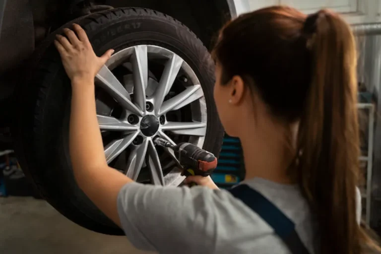 female-mechanic-working-shop-car_23-2150169978